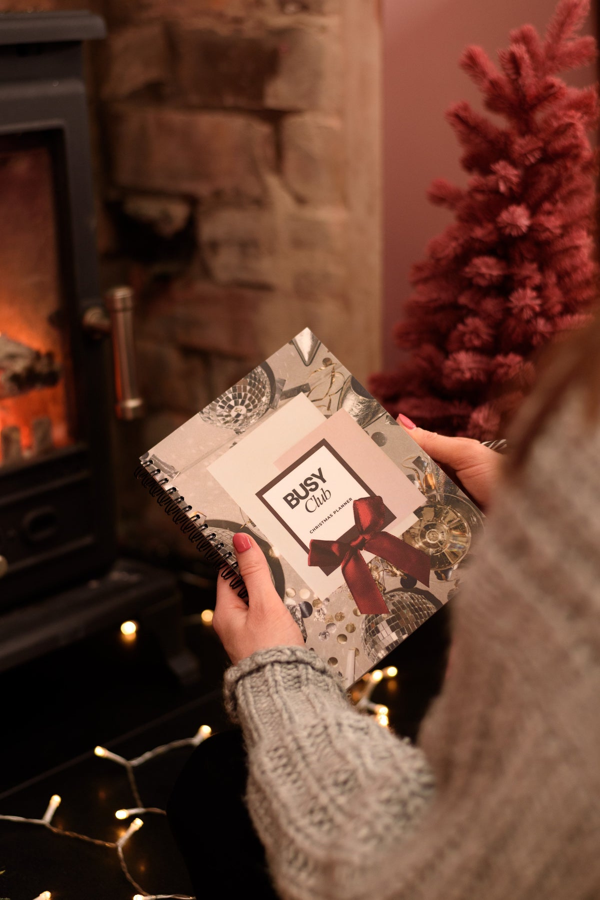 christmas planner book in front of the fire
