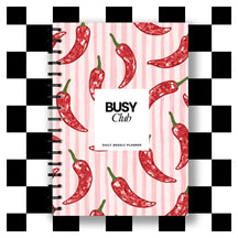 Planner with red chili pepper design on a pink background, featuring the brand 'BUSY Club'.