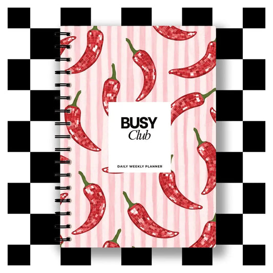 Planner with red chili pepper design on a pink background, featuring the brand 'BUSY Club'.