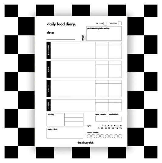 Daily food diary planner insert on a checkered background.