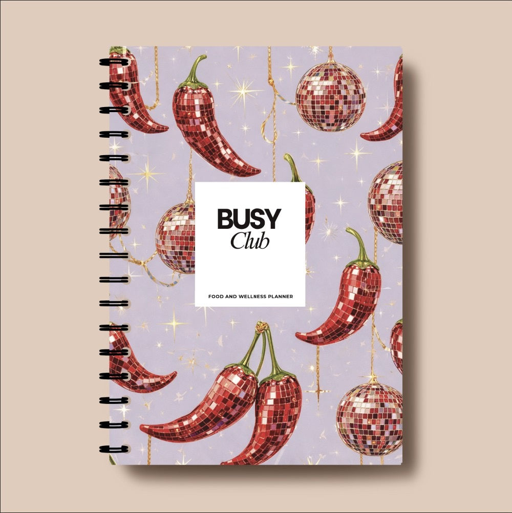 Notebook with disco ball and chili pepper design on a beige background